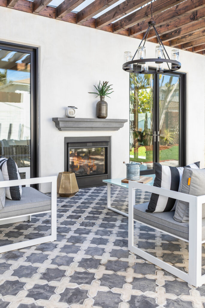 Blue and white patterned tile with vintage Colonial-style motifs.
