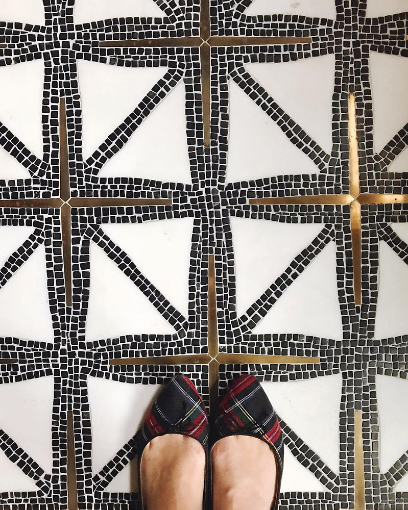 Handmade tile with star and cross motifs reminiscent of early American design.