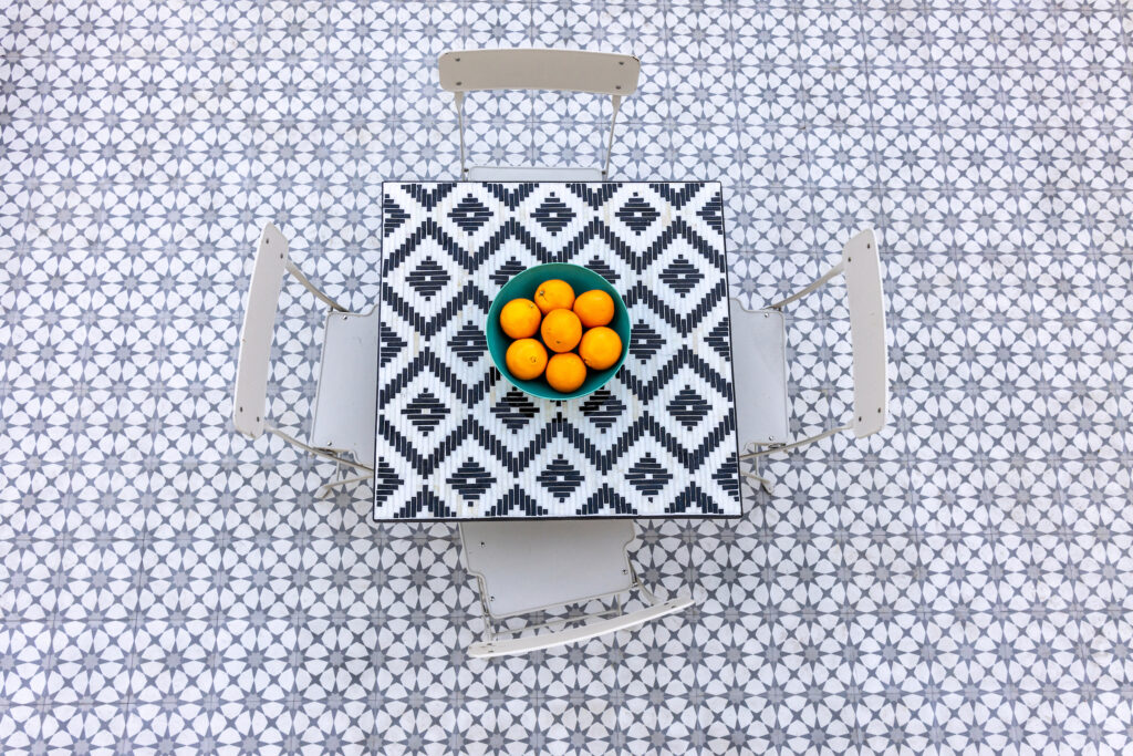 Vintage-look tile featuring star and quatrefoil pattern.