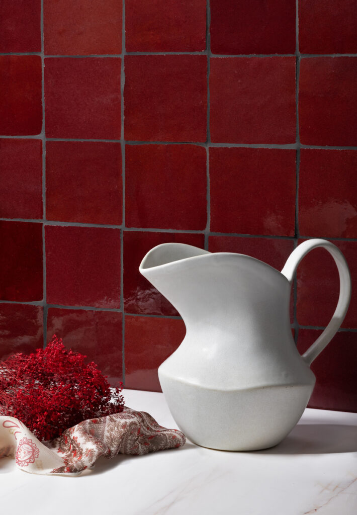 Sumac red Zellige tile with handcrafted texture and bold tonal variation.