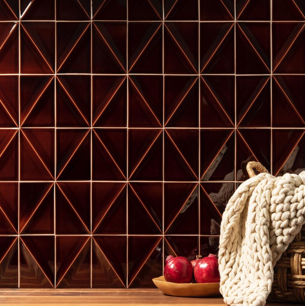 Garnet red tile with a diamond-cut surface, ideal for classic wall applications.