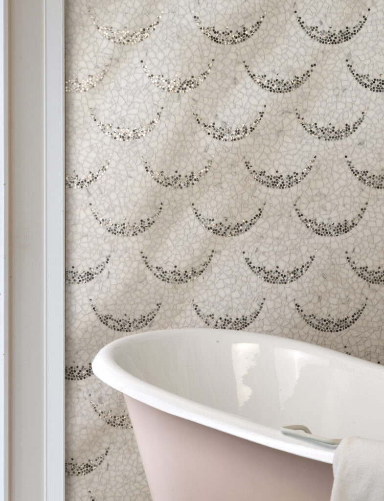 Pink bathroom with stone and mother of pearl mosaic tile accent wall