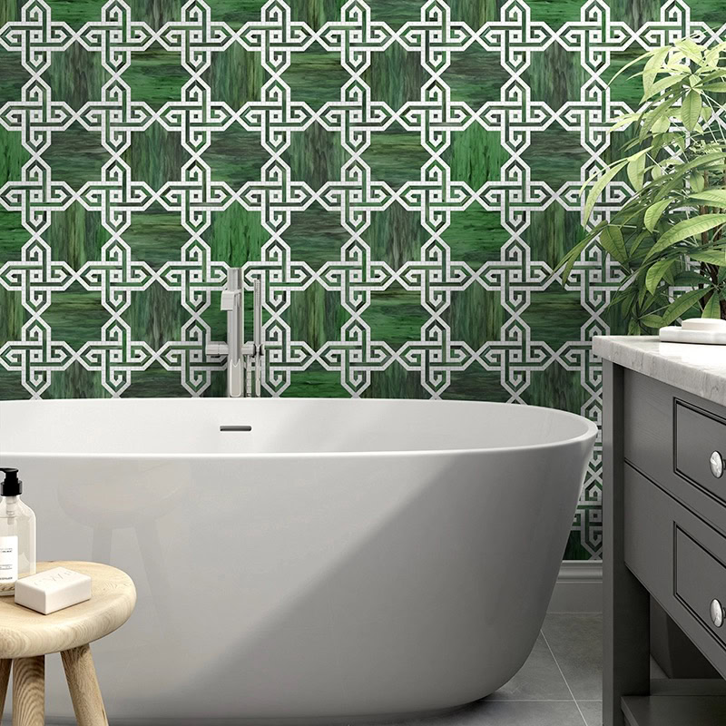 green heritage motif tile wall in bathroom setting