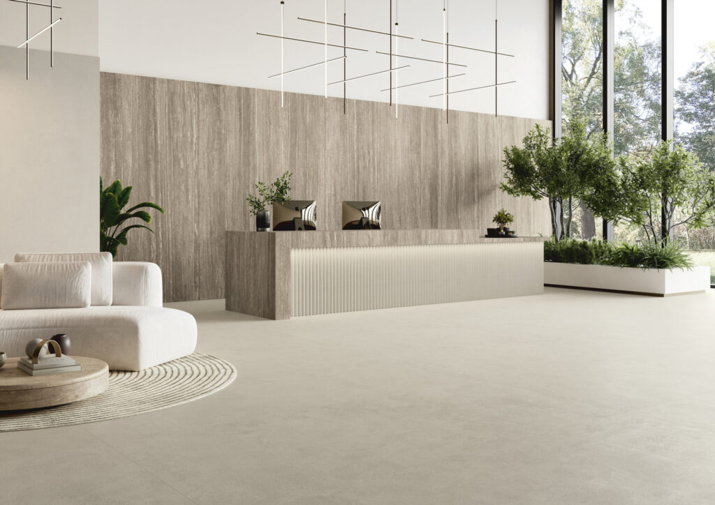 Modern cream-toned living room with light neutral flooring inspired by Pantone Cloud Dancer for tile and surface design.